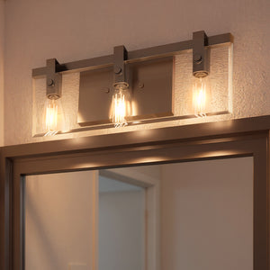 The Urban Ambiance UHP2451 Modern Farmhouse Bath Fixture from the Bristol Collection features three exposed bulbs and a sleek brushed nickel finish, measuring 8-3/8"H x 22-3/4"W—perfect for contemporary interiors.