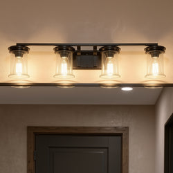 The Urban Ambiance UHP3771 French Rustic Bath Vanity Light from the Missoula Collection, featuring four bulbs and a midnight black finish, is mounted above a dark-framed doorway on a beige ceiling.