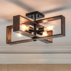 The UHP4917 Minimalist Indoor Ceiling Light from Urban Ambiance's Roswell Collection features a matte black finish and geometric design, combining wood and metal elements for a modern rustic look. Measures 9-1/4"H x 24"W x 24"D.