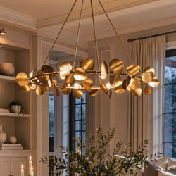 Urban Ambiance UHP4993 XL Eclectic Indoor Chandelier featuring a round, nature-inspired design with gold leaves and exposed light bulbs.