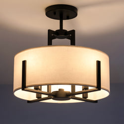 The Urban Ambiance UKC20370 Transitional Ceiling Fixture from the Oakmont Collection, featuring a black finish and measuring 14.25''H x 15.5''W x 15.5''D, effortlessly showcases transitional design elements with its round fabric shade and exposed bulbs, offering a versatile and stylish look when mounted on a white ceiling.
