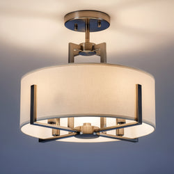 The Urban Ambiance UKC20371 Transitional Ceiling Light from the Oakmont Collection features a classic pewter metal frame paired with a round fabric drum shade, measuring 14.25'' high by 15.5'' wide. This modern semi-flush fixture emits a warm glow, making it an elegant addition to any plain ceiling.