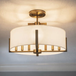 The Urban Ambiance UKC20375 Transitional Ceiling Light from the Oakmont Collection, featuring a 14.5''H x 20''W x 20''Dep size and a chic champagne bronze finish, is installed on a white textured ceiling—an ideal choice for bringing modern farmhouse style and sophisticated lighting to your space.