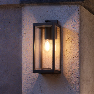 The Urban Ambiance UQL1332 Farmhouse Outdoor Wall Light (20"H x 7"W, Black, Quincy Collection) adds a warm glow and elegant touch to textured exterior walls—an ideal choice for modern outdoor lighting.