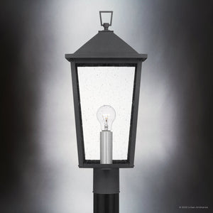 A close-up of the Urban Ambiance UQL1874 Modern Rustic Outdoor Post Light from the Elmwood Collection, featuring a mottled black marine-grade finish and clear bulb, set against a gradient gray background. Size: 22