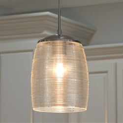 The Urban Ambiance UQL2644 San Sebastian Contemporary Pendant Light (16.5"H x 9"W, Polished Chrome) hangs above white cabinetry, providing dimmable illumination and sleek modern style for your space.