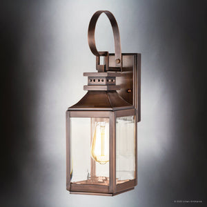 The Urban Ambiance UFS1000 Transitional Outdoor Wall Sconce from the Calderdale Collection features genuine copper in a dark-patina finish, measures 15''H x 5.5''W, and showcases a clear glass enclosure with visible bulb.