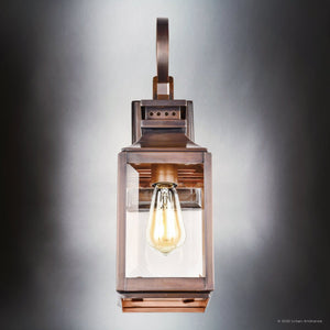 The Urban Ambiance UFS1000 wall sconce from the Calderdale Collection features genuine copper with a dark patina and a clear glass enclosure, bringing timeless appeal to any space. Measures 15''H x 5.5''W.