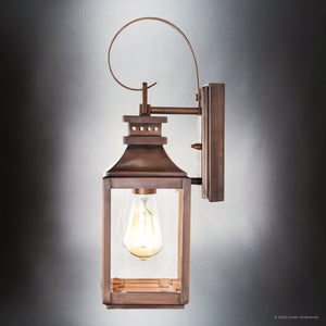 The Urban Ambiance UFS1000 Calderdale Collection features a 15''H x 5.5''W genuine copper outdoor wall sconce with a dark-patina finish and visible bulb in a rectangular glass enclosure, shown against a gray gradient background.