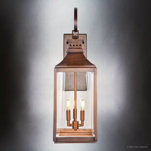 The Urban Ambiance UFS1002 Calderdale Collection wall sconce features a genuine copper, dark-patina finish with a rectangular glass enclosure and two exposed bulbs, measuring 28.5''H x 9.5''W—perfect for transitional outdoor spaces.