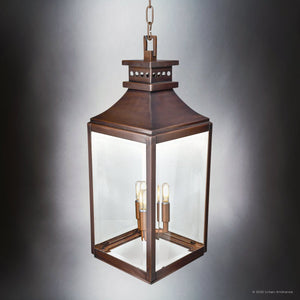 The Urban Ambiance UFS1004 Calderdale pendant light, with genuine copper and dark-patina finish, features clear glass panels and three candle-style LED bulbs suspended from a chain.