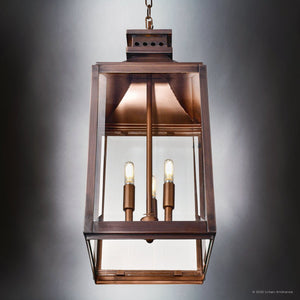 The Urban Ambiance UFS1004 Calderdale Collection features a 26.5''H x 9.5''W transitional outdoor pendant in genuine copper with dark-patina finish, showcasing beveled glass panels and two exposed bulbs, suspended by a chain.