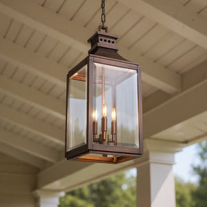 The Urban Ambiance Calderdale UFS1004 Transitional Outdoor Pendant Light (26.5''H x 9.5''W) features genuine copper with a dark patina, adding timeless charm to your porch ceiling with its elegant design.