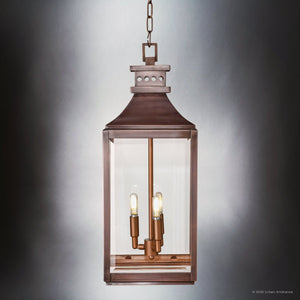 The Urban Ambiance UFS1004 Calderdale Collection features a 26.5''H x 9.5''W rectangular outdoor pendant light in genuine copper with a dark-patina finish and beveled glass, suspended by chain for transitional style.