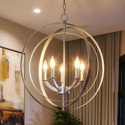 The UHP2326 Luxe Industrial Chandelier from the Arezzo Collection by Urban Ambiance features exposed bulbs and concentric metal rings in a sophisticated brushed nickel finish. Measuring 24-3/8″ high by 22″ wide, this striking ceiling light hangs elegantly in contemporary rooms with curtains and abstract artwork, adding a refined touch to any modern space.