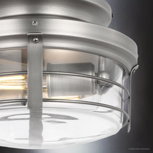 Close-up of the UHP9477 Tuscan Indoor Ceiling Fan from Urban Ambiance, featuring an industrial-style brushed metal and glass light kit with a visible bulb and protective cage, measuring 26-1/4''H x 60