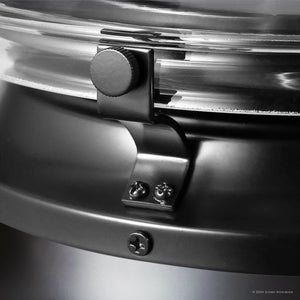 A close-up showcases the precision of a metal latch securing a clear lid on a dark container, akin to the meticulous craftsmanship of the UHP9482 Tuscan Indoor Ceiling Fan from Urban Ambiance's Saybrook Collection in Matte Black.