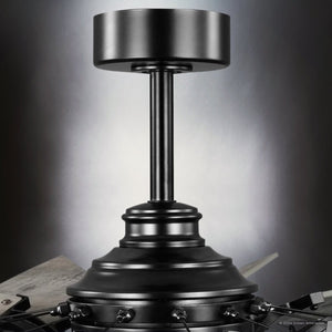 Close-up of a metallic mechanical device with a cylindrical top and central post, reminiscent of the Urban Ambiance Saybrook Collection's UHP9482 Tuscan Indoor Ceiling Fan in a Matte Black Finish, set against a neutral background.
