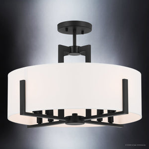 The Urban Ambiance UKC20373 Transitional Indoor Ceiling Light from the Oakmont Collection features a round drum-shaped fabric shade and a striking black metal frame mounted to a dark ceiling base, all illuminated against a subtle gray gradient background. Measuring 14.5