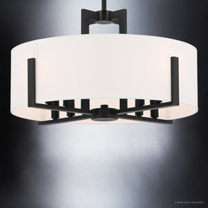 Introducing the Urban Ambiance UKC20373 Transitional Indoor Ceiling Light from the Oakmont Collection, featuring a sleek black finish frame and a white drum-shaped fabric shade. This modern ceiling fixture measures 14.5''H x 20''W x 20''Depth, making it an elegant addition to any space when suspended from the ceiling against a gray backdrop.