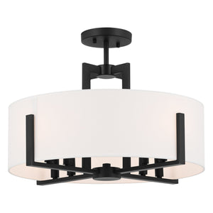 The Urban Ambiance UKC20373 Transitional Indoor Ceiling Light from the Oakmont Collection features a crisp white, drum-shaped fabric shade paired with black metal accents and mounted on a sleek black base. Measuring 14.5''H x 20''W x 20''Dep, this stylish ceiling light in a sophisticated black finish blends clean lines with timeless appeal, making it an ideal choice for both contemporary and classic interiors.