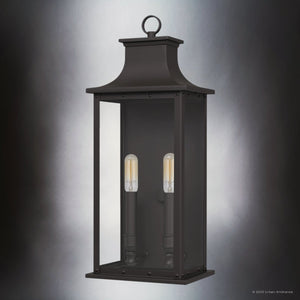 The Urban Ambiance UQL1720 Halle Collection Classic Outdoor Wall Sconce features a rectangular old bronze marine-grade design with two vertical bulbs inside clear beveled glass, measuring 19.50''H x 8.25''W x 6.50''D.
