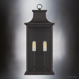 The Urban Ambiance UQL1720 Classic Outdoor Wall Sconce from the Halle Collection features an old bronze finish, marine-grade construction, and a rectangular design with two vertical bulbs and beveled glass. Size: 19.50''H x 8.25''W x 6.50''D.