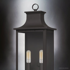 The Urban Ambiance UQL1720 Classic Outdoor Wall Sconce from the Halle Collection features an old bronze finish, beveled glass, and two visible vertical bulbs; it is photographed against a neutral gradient background.