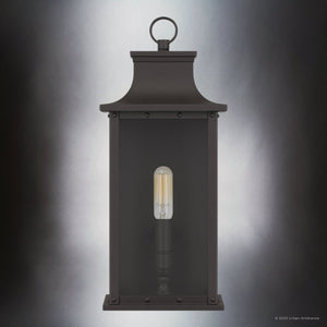 The Urban Ambiance UQL1721 Classic Outdoor Wall Sconce from the Halle Collection features a 15.50''H x 6.50''W x 5.50''D marine-grade rectangular design in an old bronze finish with beveled glass panels, highlighting an exposed bulb.
