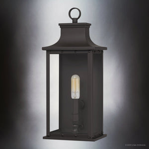 The UQL1721 Classic Outdoor Wall Sconce by Urban Ambiance features an old bronze finish, beveled glass panels, a rectangular frame, and a visible bulb. Part of the Halle Collection, it's marine-grade and measures 15.50''H x 6.50''W x 5.50''D.