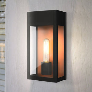 The UQL1801 Luxe Industrial Outdoor Wall Sconce by Urban Ambiance features a matte black finish and marine-grade construction, adding modern industrial style to your exterior.