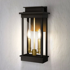 The Urban Ambiance UQL1820 Selby outdoor wall sconce features a matte black marine-grade finish in a new traditional lantern style, sized 15.50"H x 7.50"W x 5.50"D, and is shown here mounted on a white textured wall.