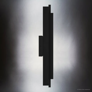 The Urban Ambiance UQL1840 Modern Outdoor Wall Sconce from the Juniper Collection, shown in matte black with marine-grade construction (20.50''H x 5.75''W x 3.75''D), is pictured in profile against a softly lit gradient background.