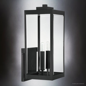 The Urban Ambiance UQL1892 Modern Farmhouse Outdoor Wall Sconce from the Quincy Collection features a rectangular black metal frame and beveled glass, with two vertical bulbs, mounted on a flat base. Size: 22.75''H x 9''W x 10.25''D.