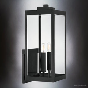 The Urban Ambiance UQL1892 Modern Farmhouse Outdoor Wall Sconce from the Quincy Collection features a natural black finish, clear glass panels, and two exposed vertical bulbs for a stylish touch. Measures 22.75''H x 9''W x 10.25''D.