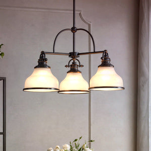 Suspended from the ceiling in a softly lit room, the Urban Ambiance UQL2332 Industrial Chandelier from the Pasadena Collection features three opal etched glass shades and a dark Parisian Bronze finish, evoking timeless elegance.
