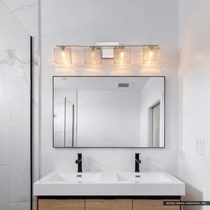 Modern bathroom vanity with double sinks, a large rectangular mirror, and the Urban Ambiance UQL2724 Modern Bathroom Light from the San Diego Collection in brushed nickel elegantly mounted above for contemporary lighting. Marble wall detail is visible on the left side.