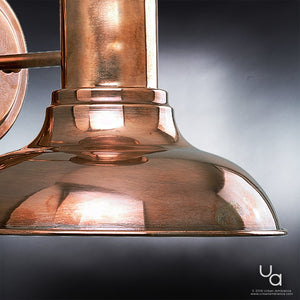 An UHP1020 Industrial Chic Outdoor Wall Light with a unique solid copper finish from the Palermo Collection by Urban Ambiance.