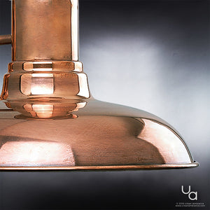 Close-up of the Urban Ambiance UHP1023 Luxe Industrial Outdoor Wall Light from the Palermo Collection, featuring a polished solid copper finish and measuring 10.75 inches high by 10 inches wide, shown with its reflective surface against a simple gray gradient background.