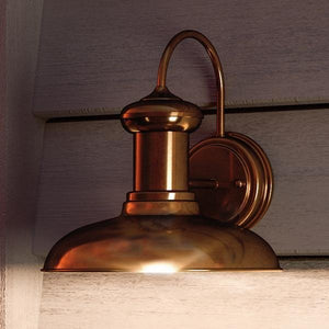 An Urban Ambiance UHP1023 Industrial Chic Outdoor Wall Light from the Palermo Collection with a solid copper finish, exuding luxury and beauty.
