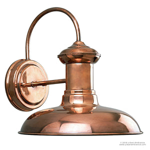 The Urban Ambiance UHP1023 Luxe Industrial Outdoor Wall Light from the Palermo Collection features a solid copper finish and a gracefully curved arm with a round base, offering vintage charm and sophisticated shine to any exterior space. With its 10.75″ height and 10″ width, this wall-mounted sconce beautifully reflects light for an inviting ambiance.