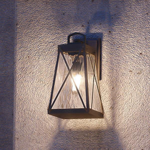 A beautiful English Tudor Outdoor Wall Light, 11-1/2"H x 6"W, on a wall.