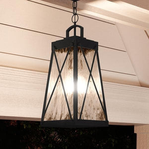 A unique and gorgeous English Tudor outdoor pendant lamp, the Urban Ambiance UHP1059, hangs from a porch in the Saint Paul Collection.