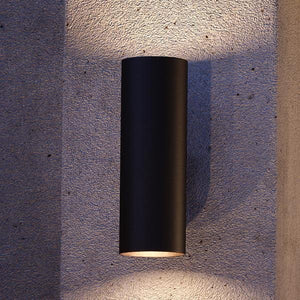 A luxurious UHP1064 Contemporary Outdoor Wall Light, with a gorgeous Olde Bronze Finish, from the Hollywood Collection, on a concrete wall.