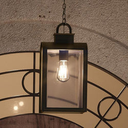A gorgeous UHP1104 Art Deco Outdoor Pendant Light, 16"H x 8"W, with a Oil Rubbed Bronze Finish from the Chesterfield Collection by Urban Ambiance hanging from a