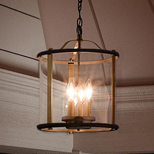 A gorgeous rustic outdoor ceiling lamp from the Plymouth Collection, hanging from the porch.