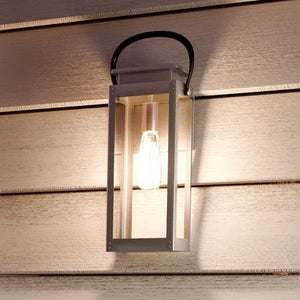 A Gorgeous Modern Farmhouse Outdoor Wall Light, Stainless Steel Finish, Darwin Collection on the side of a house.