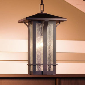A beautiful UHP1151 Craftsman Outdoor Pendant Light, 19-5/8" x 11", Olde Bronze Finish, Essen Collection hanging from a ceiling in a room.