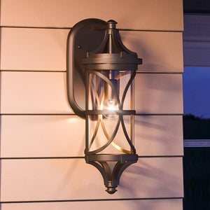 A gorgeous and beautiful Urban Ambiance UHP1188 Rustic Outdoor Wall Light, 25-1/2" x 9", Olde Bronze Finish, Brussels Collection with a light on it