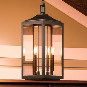 An Urban Ambiance UHP1191 Colonial Outdoor Pendant Light, 23-3/4" x 9-1/2", Olde Bronze Finish, Calderdale Collection hanging from a ceiling.